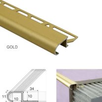 tile-in anti-slip stair nosing showing flush fit and smooth finish in gold