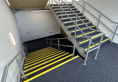 Close-up of anti-slip stair nosing installed on steps for improved safety