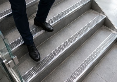 Anti-slip stair nosing installed on modern commercial stairs for improved safety and grip