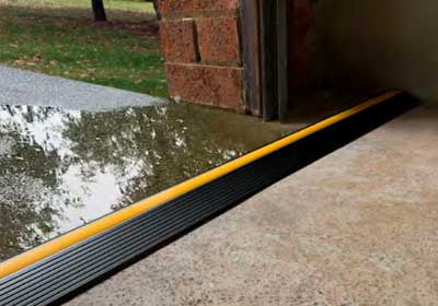 Close-up of a door threshold blocking water and air leaks