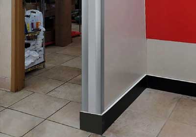 Wall corner protector installed to prevent chips and damage in a hallway