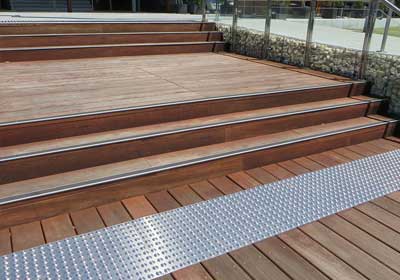 Metal bars and edging profiles installed on stairs and flooring for added safety